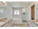Bathroom with soaking tub, walk-in shower, and stained glass window at 2075 Carlysle Park Ln, Lawrenceville, GA 30044