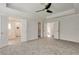 Main bedroom with carpet, ceiling fan, and access to bathroom at 2075 Carlysle Park Ln, Lawrenceville, GA 30044