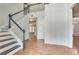 Bright entryway with hardwood floors and staircase at 2075 Carlysle Park Ln, Lawrenceville, GA 30044