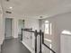 Upstairs hallway with dark hardwood floors and white railings at 2075 Carlysle Park Ln, Lawrenceville, GA 30044