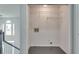 Laundry closet with wire shelving and dark flooring at 2075 Carlysle Park Ln, Lawrenceville, GA 30044