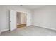 Bedroom featuring neutral walls, soft carpet, and double doors at 261 Martin Spring Rd, Lawrenceville, GA 30045