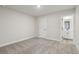 Bright bedroom with plush carpeting and a door leading to the en-suite bathroom at 261 Martin Spring Rd, Lawrenceville, GA 30045
