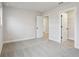Bedroom view showcasing an open door to a closet and a doorway leading to another room at 261 Martin Spring Rd, Lawrenceville, GA 30045