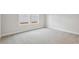 Bright bedroom featuring neutral walls and soft carpeting at 261 Martin Spring Rd, Lawrenceville, GA 30045