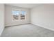 Bright bedroom with neutral walls, carpet, and a window offering a pleasant view at 261 Martin Spring Rd, Lawrenceville, GA 30045