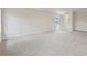 Large bedroom with neutral walls, carpet floors, and natural light from windows at 261 Martin Spring Rd, Lawrenceville, GA 30045