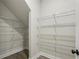 Walk-in closet with grey wood floors and wire shelving at 261 Martin Spring Rd, Lawrenceville, GA 30045
