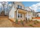 Charming two-story home with a brick and siding facade, a covered porch, and a well-manicured front yard at 261 Martin Spring Rd, Lawrenceville, GA 30045