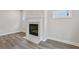Cozy living room featuring a modern fireplace, hardwood floors, and natural light at 261 Martin Spring Rd, Lawrenceville, GA 30045