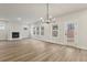 Spacious living room with hardwood floors, a fireplace, many windows and a glass door at 261 Martin Spring Rd, Lawrenceville, GA 30045