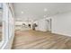 A bright, open-concept living space with hardwood floors connecting to the kitchen at 261 Martin Spring Rd, Lawrenceville, GA 30045
