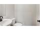 Powder room featuring neutral walls and modern fixtures at 261 Martin Spring Rd, Lawrenceville, GA 30045
