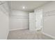 Bright walk-in closet with neutral carpeting and wire shelving for optimized storage space at 261 Martin Spring Rd, Lawrenceville, GA 30045