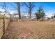 Large backyard with trees and wooden fence at 883 Gaston Sw St, Atlanta, GA 30310