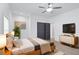 Cozy bedroom with a ceiling fan, natural light, and closet for ample storage and relaxation at 883 Gaston Sw St, Atlanta, GA 30310