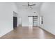 Open bedroom space with high ceilings, a modern sliding barn door, and neutral paint at 883 Gaston Sw St, Atlanta, GA 30310