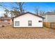 Rear view of house with light-colored siding and windows at 883 Gaston Sw St, Atlanta, GA 30310