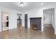 Bright living room with hardwood floors and a purple brick fireplace at 883 Gaston Sw St, Atlanta, GA 30310