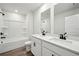 Bathroom with dual sinks and granite counters, plus shower-tub combo at 281 Martin Spring Rd, Lawrenceville, GA 30045