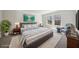 This bedroom features a comfortable bed, soft carpet, and a bright window view at 281 Martin Spring Rd, Lawrenceville, GA 30045