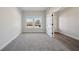 Bedroom featuring carpet and large window, with a door leading into another room at 281 Martin Spring Rd, Lawrenceville, GA 30045