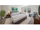 This bedroom features a comfortable bed, soft carpet, and a bright window view at 281 Martin Spring Rd, Lawrenceville, GA 30045