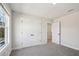 Bright bedroom featuring plush carpet, neutral walls, and closet for ample storage space at 281 Martin Spring Rd, Lawrenceville, GA 30045
