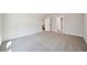 Spacious bonus room with neutral carpet and white trim is perfect for entertaining at 281 Martin Spring Rd, Lawrenceville, GA 30045