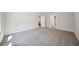 Spacious bonus room with neutral carpet and white trim is perfect for entertaining at 281 Martin Spring Rd, Lawrenceville, GA 30045