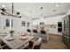 Bright kitchen with stainless appliances, an island with bar seating, and an adjacent dining area at 281 Martin Spring Rd, Lawrenceville, GA 30045