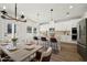 Bright kitchen with stainless appliances, an island with bar seating, and an adjacent dining area at 281 Martin Spring Rd, Lawrenceville, GA 30045