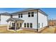 Two-story home with white siding, a covered patio, and a well-manicured lawn at 281 Martin Spring Rd, Lawrenceville, GA 30045