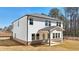 Two-story home with white siding, a covered patio, and a well-manicured lawn at 281 Martin Spring Rd, Lawrenceville, GA 30045