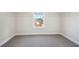Bright walk-in closet with carpet and window, featuring modern wire shelving at 281 Martin Spring Rd, Lawrenceville, GA 30045