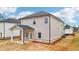 Spacious backyard with a covered patio, perfect for outdoor gatherings and relaxation at 711 Lily Blossom Path, Lawrenceville, GA 30045