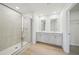 Elegant bathroom with a glass-enclosed shower and double vanity at 711 Lily Blossom Path, Lawrenceville, GA 30045