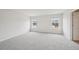 Bright, carpeted bedroom with two windows providing natural light at 711 Lily Blossom Path, Lawrenceville, GA 30045