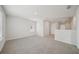 Bonus room featuring plush neutral carpeting, bright natural light, and hallway view at 711 Lily Blossom Path, Lawrenceville, GA 30045