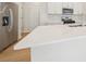 Modern kitchen featuring a large kitchen island, stainless steel appliances and white cabinetry at 711 Lily Blossom Path, Lawrenceville, GA 30045