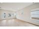 Bright living room featuring wood floors, recessed lighting and ample windows offering plenty of natural light at 711 Lily Blossom Path, Lawrenceville, GA 30045