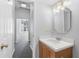 Small bathroom with vanity and view of bedroom at 32 Peachtree Nw St # 804, Atlanta, GA 30303