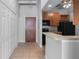 Galley kitchen with wood cabinets and black appliances at 32 Peachtree Nw St # 804, Atlanta, GA 30303
