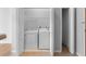 Stackable washer and dryer in a well-lit laundry closet at 32 Peachtree Nw St # 804, Atlanta, GA 30303