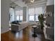 Living room with hardwood floors, large windows, and city views at 32 Peachtree Nw St # 804, Atlanta, GA 30303