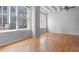 Spacious living room with hardwood floors and large windows offering city views at 32 Peachtree Nw St # 804, Atlanta, GA 30303