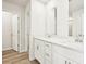 Bright bathroom with double vanity sinks, modern fixtures, and plenty of storage at 602 Wallace Oak Ln, Lawrenceville, GA 30045