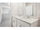 Bathroom featuring double sinks, modern fixtures, and open design at 602 Wallace Oak Ln, Lawrenceville, GA 30045