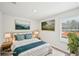 Staged bedroom with coordinated decor, a plush bed, and natural light creates a cozy, inviting atmosphere at 602 Wallace Oak Ln, Lawrenceville, GA 30045