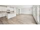 Modern kitchen featuring white cabinets, an island, stainless steel appliances, and hardwood floors at 602 Wallace Oak Ln, Lawrenceville, GA 30045